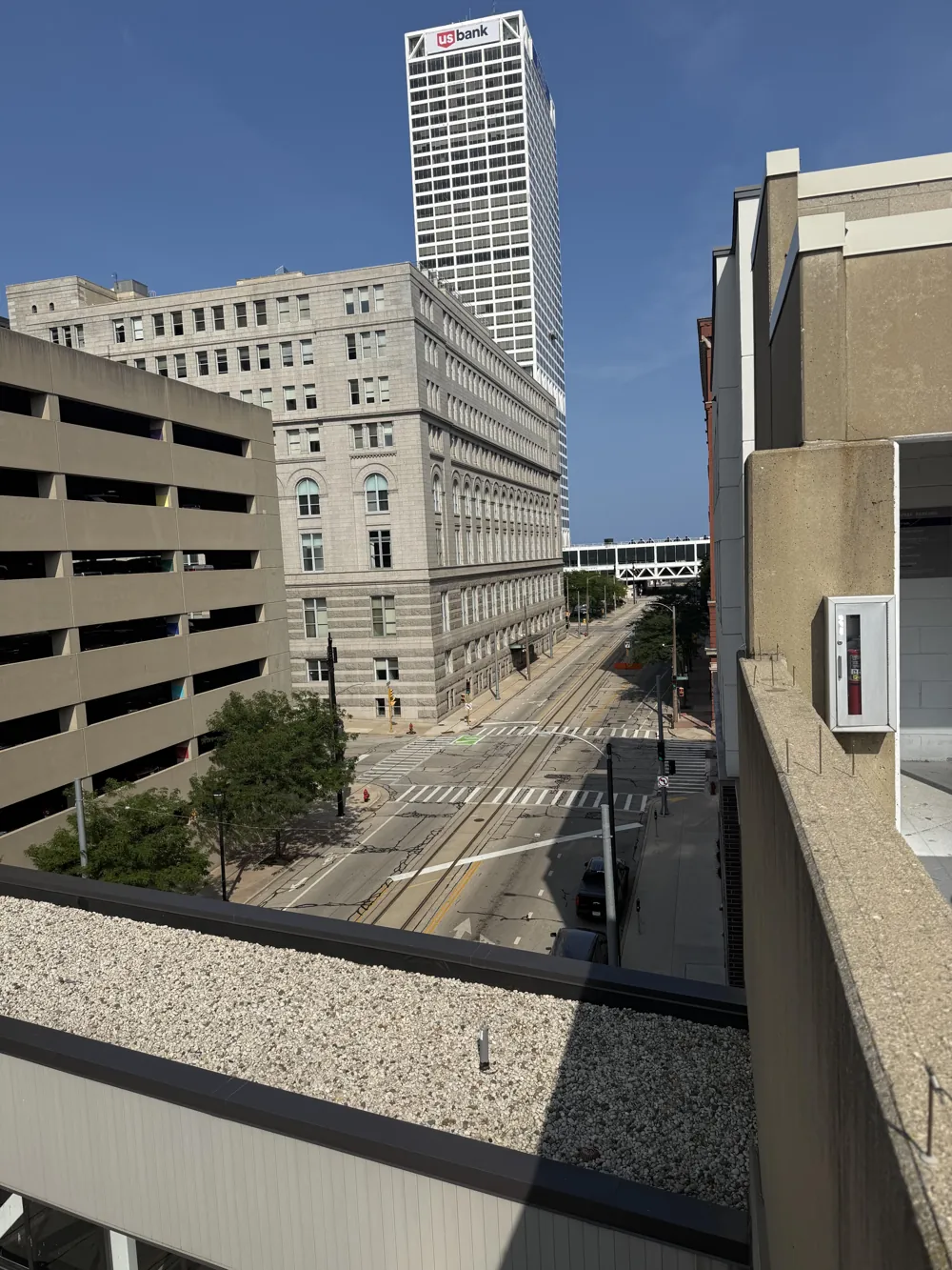 Downtown Milwaukee street with the U.S. Bank Center above historic buildings
